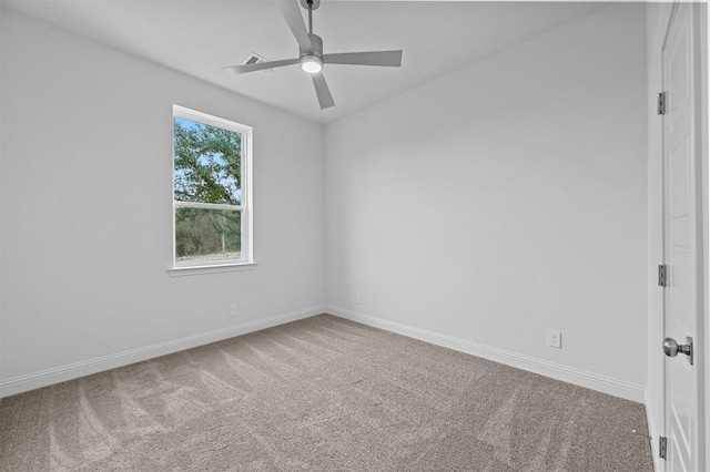 carpeted empty room featuring ceiling fan