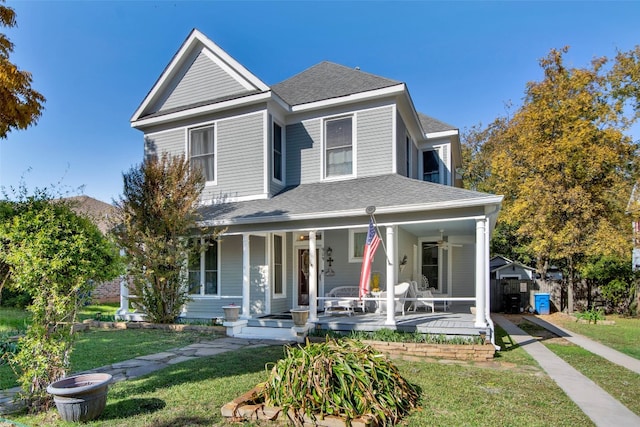 view of front of home featuring a front yard and a porch