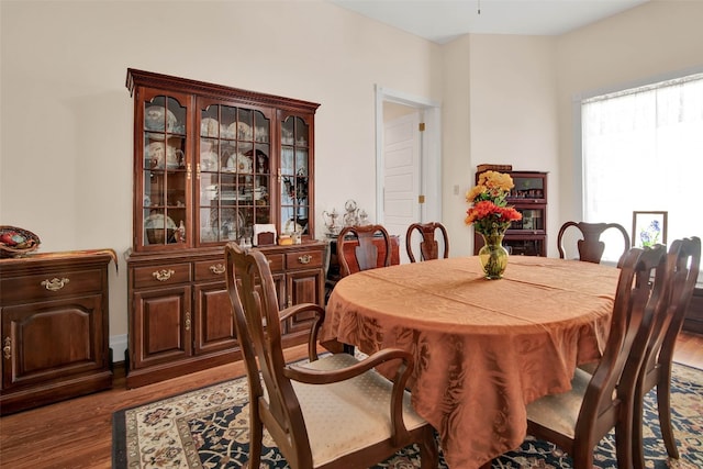 dining space with dark hardwood / wood-style floors