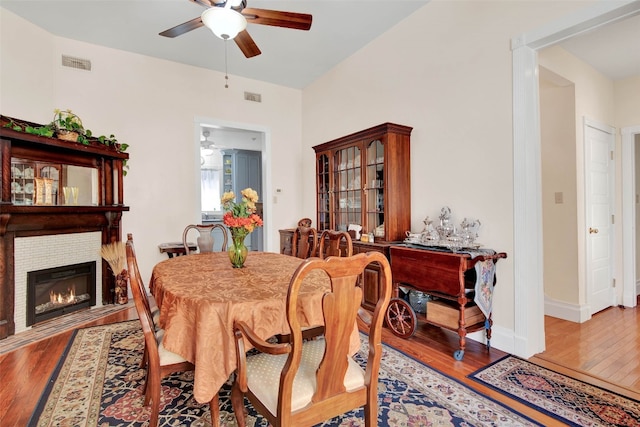 dining area with ceiling fan and light hardwood / wood-style flooring