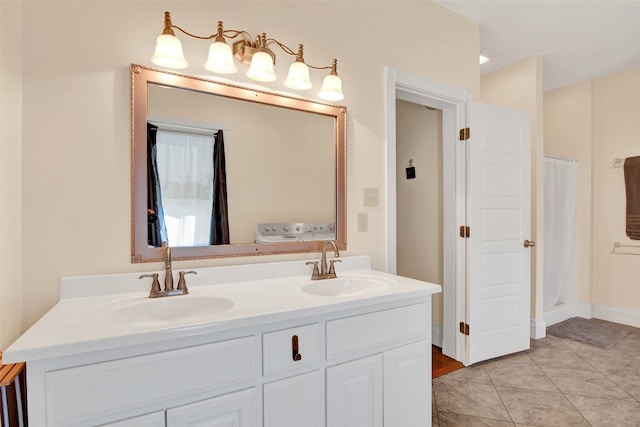 bathroom with dual sinks, tile flooring, and vanity with extensive cabinet space