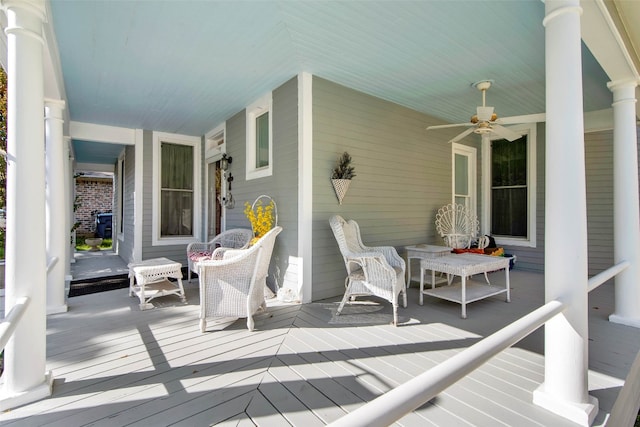 wooden deck with ceiling fan