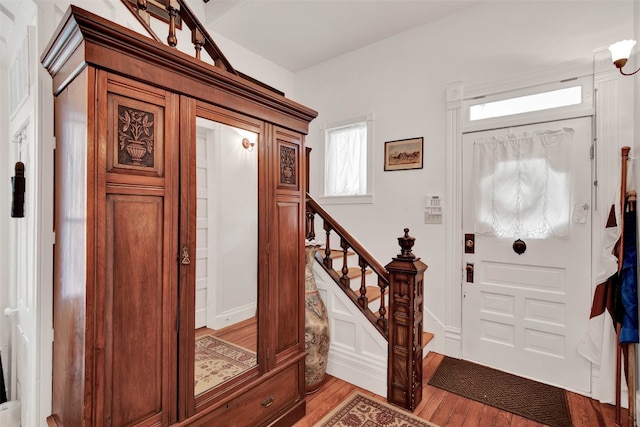 foyer entrance with light wood-type flooring