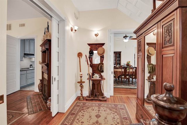 interior space featuring hardwood / wood-style floors and lofted ceiling