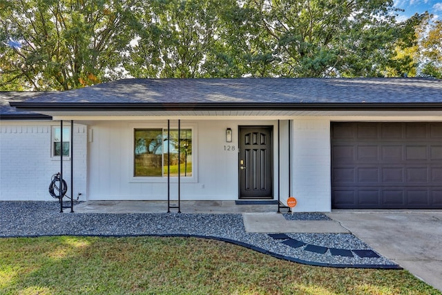 view of front of property with a porch and a garage