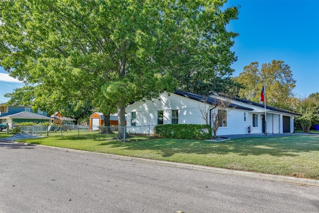 view of property exterior with a garage and a lawn