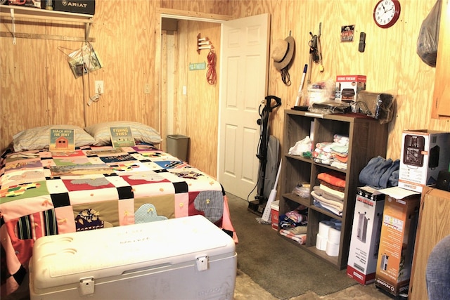 bedroom with wood walls