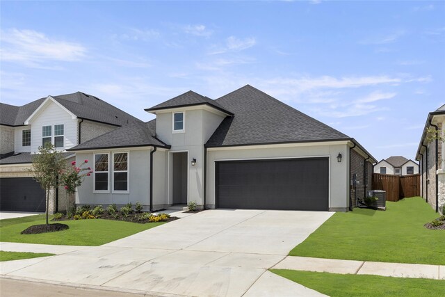 view of front facade featuring a garage and a front lawn