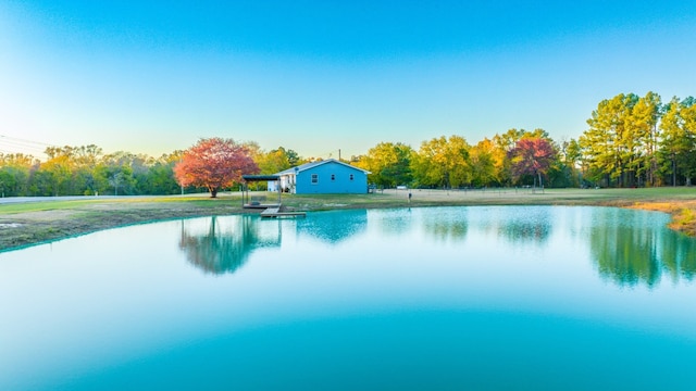 view of pool with a water view