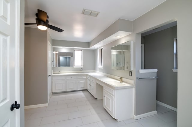 bathroom with tile flooring, double vanity, and ceiling fan