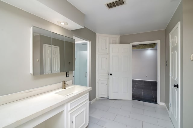 bathroom with tile floors and large vanity