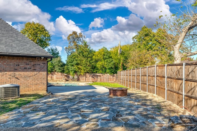 exterior space featuring central AC and a patio