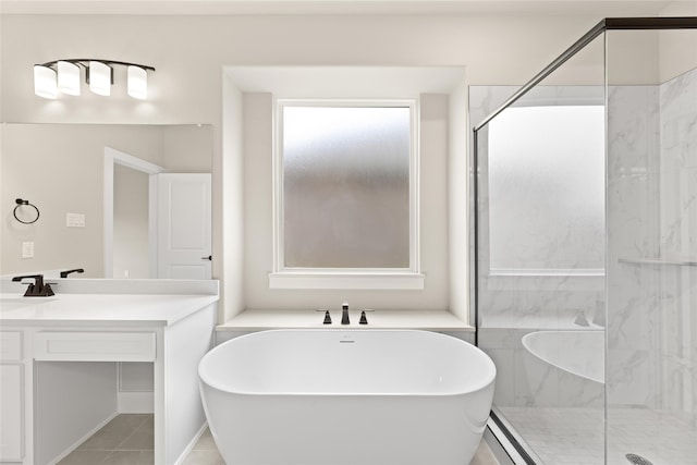 bathroom featuring vanity, tile patterned floors, and plus walk in shower