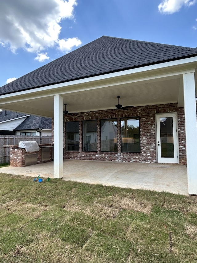 view of patio / terrace with grilling area and fence