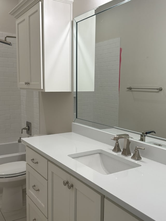 full bath featuring vanity, shower / bathing tub combination, and toilet