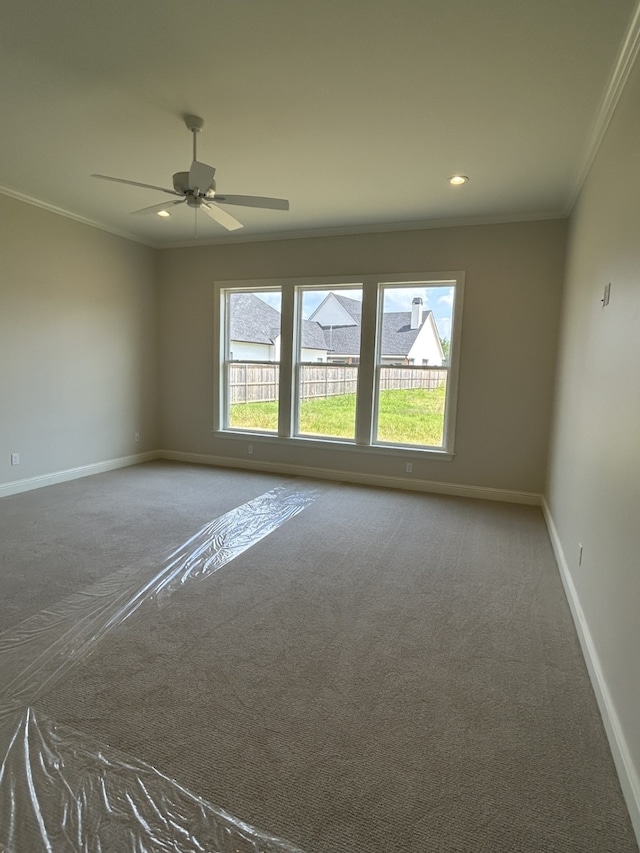 unfurnished room featuring carpet flooring, recessed lighting, baseboards, and ornamental molding