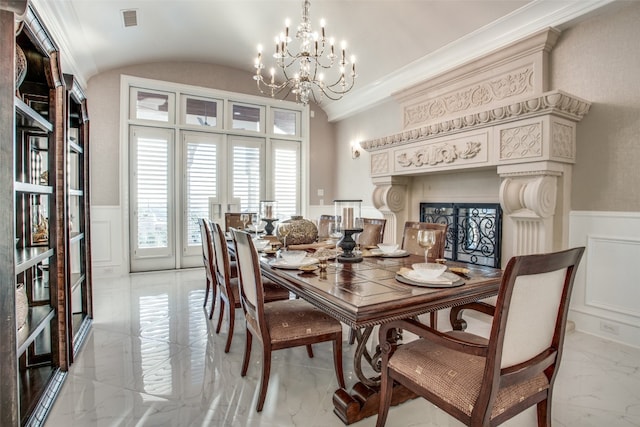 tiled dining room featuring an inviting chandelier, crown molding, lofted ceiling, and french doors