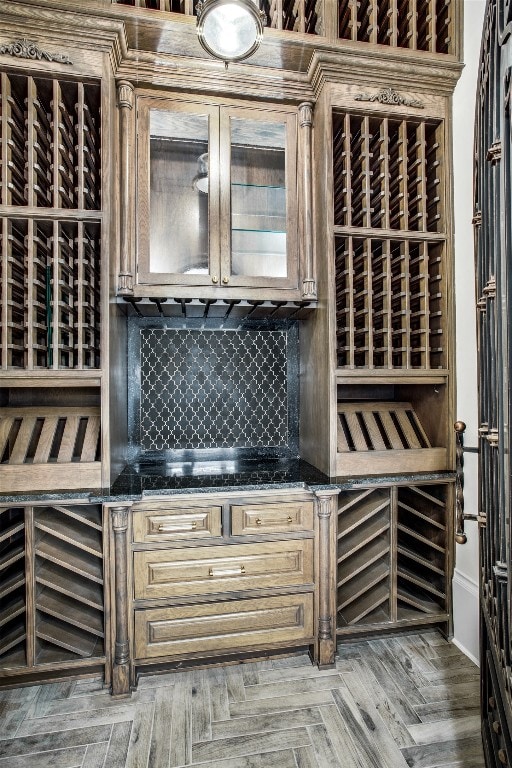 wine cellar featuring bar area and parquet floors