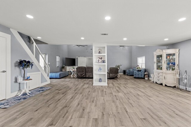 unfurnished living room with light hardwood / wood-style floors