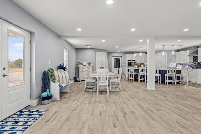 dining room with light wood-type flooring