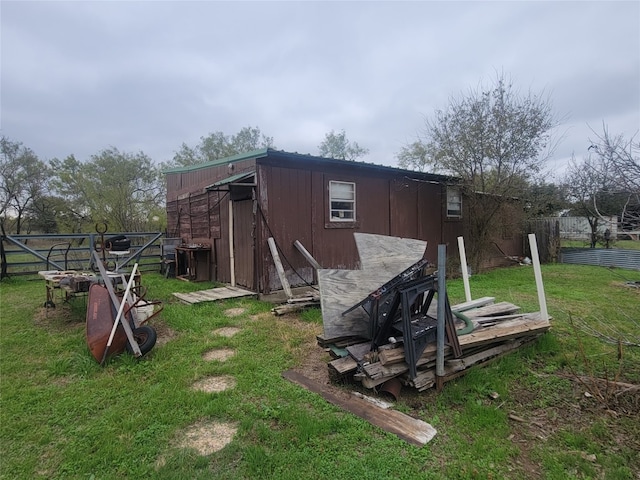 view of outdoor structure with a lawn