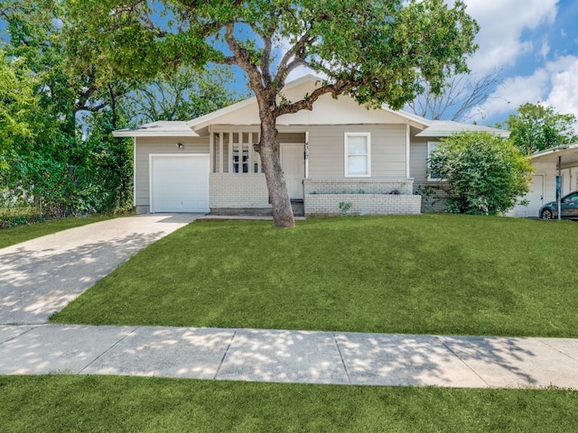 ranch-style home with a front yard and a garage