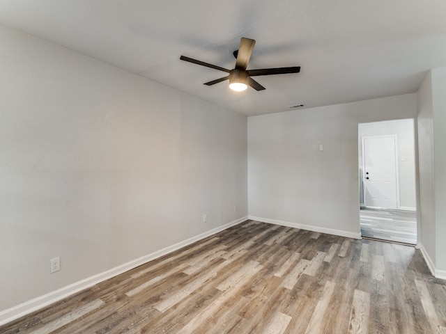 unfurnished room with light hardwood / wood-style floors and ceiling fan