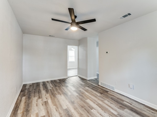 unfurnished room with ceiling fan and light hardwood / wood-style flooring