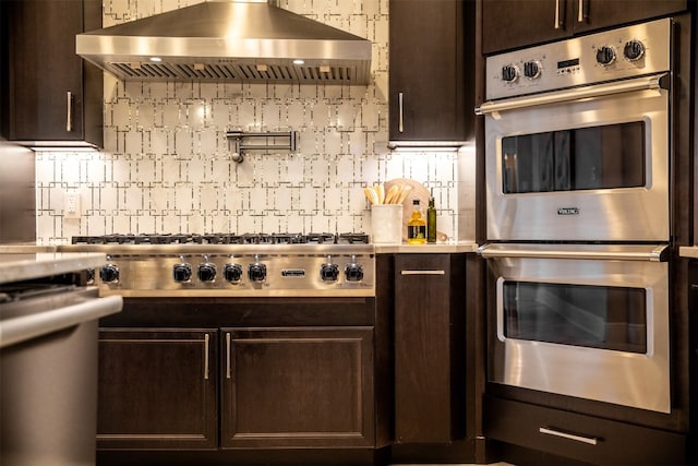 kitchen with tasteful backsplash, stainless steel appliances, ventilation hood, and dark brown cabinets