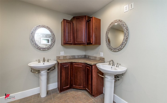 bathroom with tile flooring and sink