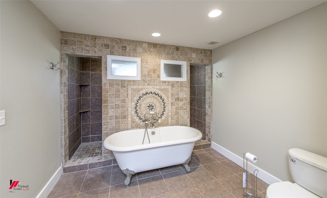 bathroom with shower with separate bathtub, toilet, and tile flooring