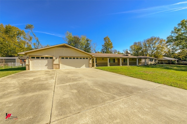 ranch-style home featuring a front yard and a garage