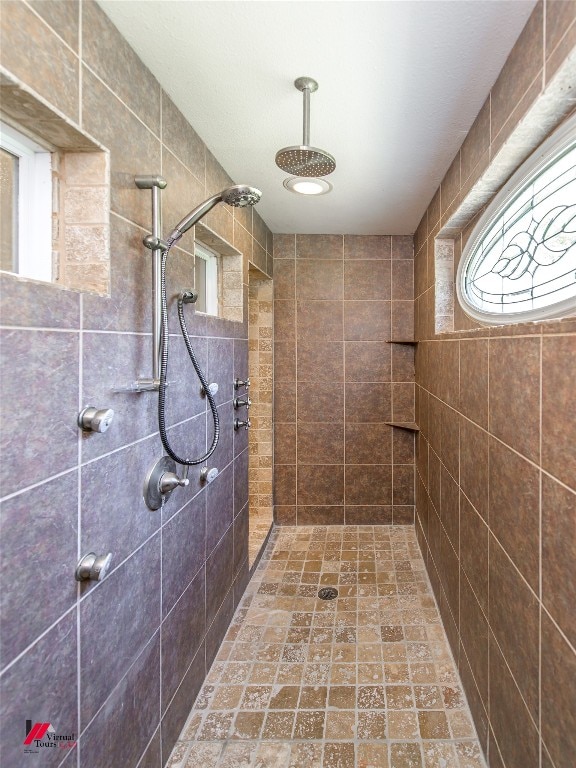 bathroom with tiled shower