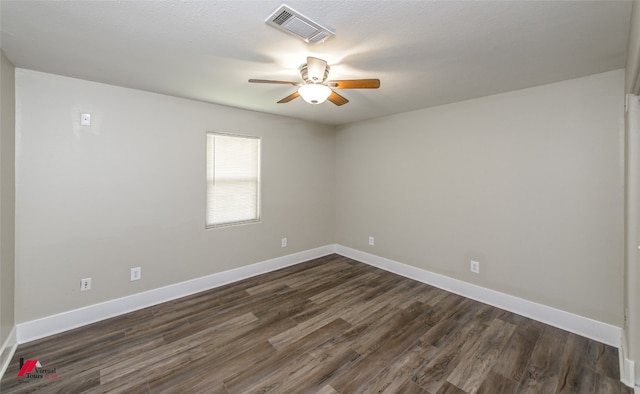 spare room with ceiling fan and dark hardwood / wood-style floors