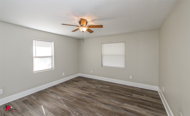 unfurnished room with ceiling fan and dark hardwood / wood-style flooring