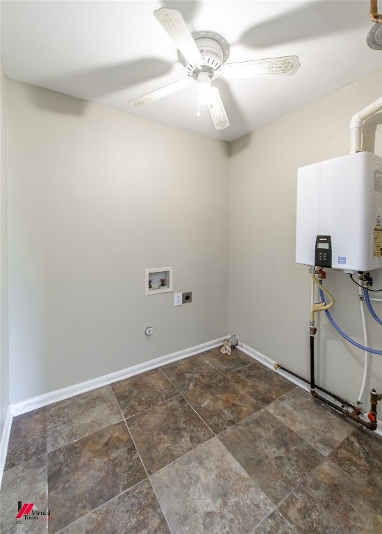 laundry area featuring ceiling fan, electric dryer hookup, hookup for a washing machine, water heater, and dark tile flooring