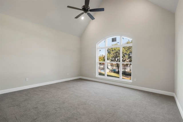 empty room with ceiling fan, dark colored carpet, and high vaulted ceiling