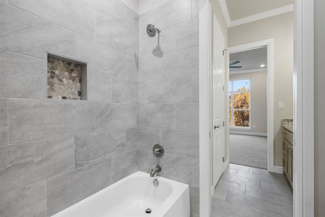 bathroom featuring ornamental molding, vanity, tiled shower / bath, and tile flooring