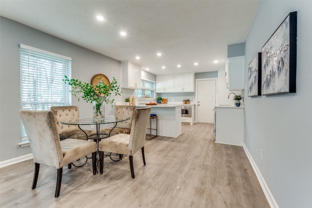 dining room featuring light hardwood / wood-style floors