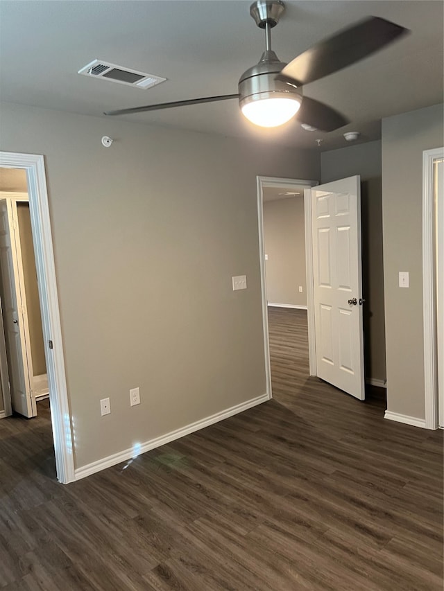 interior space featuring ceiling fan and dark hardwood / wood-style flooring