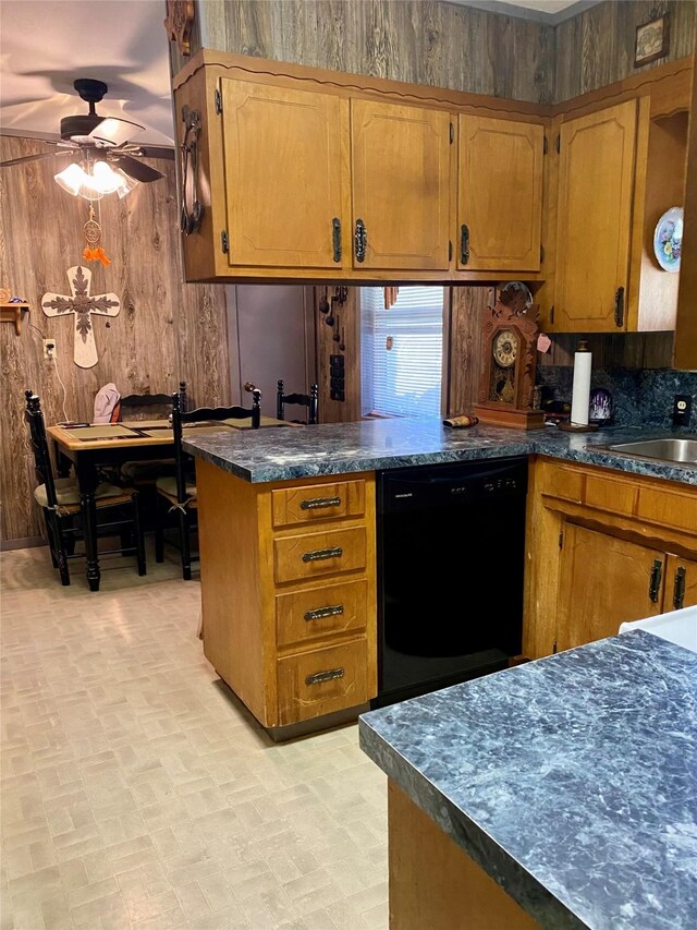 kitchen featuring kitchen peninsula, black dishwasher, ceiling fan, and sink