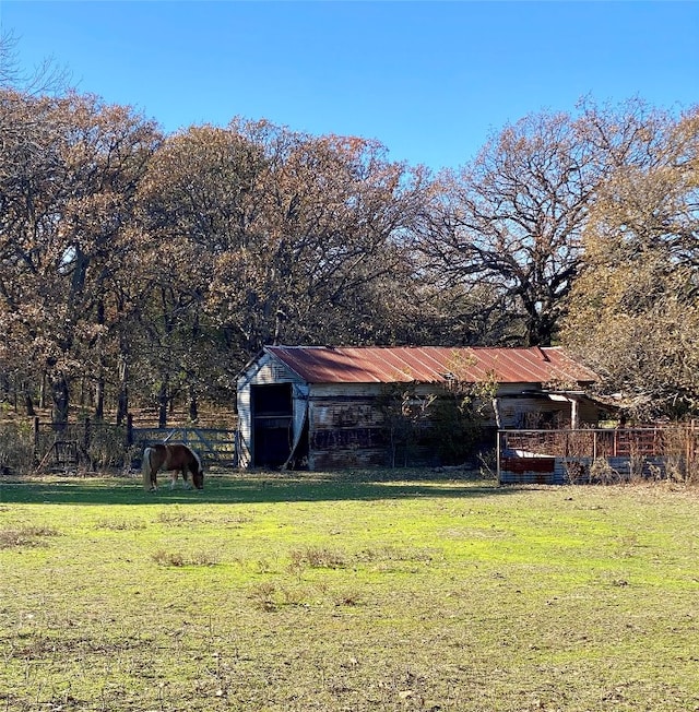 view of yard with a rural view