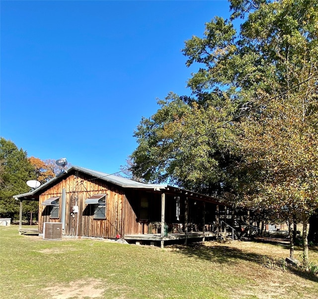 view of home's exterior with a yard