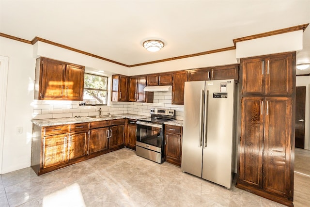 kitchen with light tile flooring, appliances with stainless steel finishes, sink, backsplash, and light stone counters