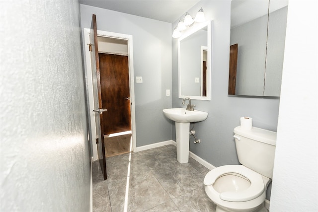 bathroom with tile floors and toilet