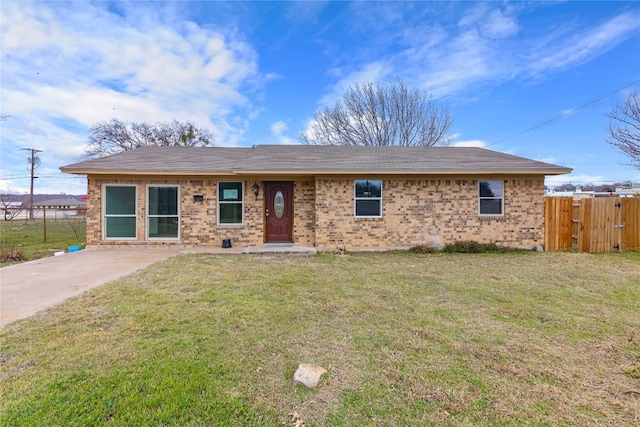 ranch-style home with a front lawn