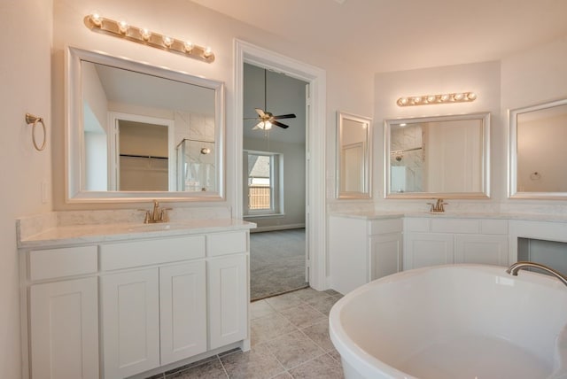 bathroom with separate shower and tub, ceiling fan, and vanity