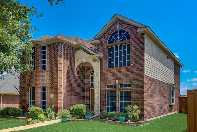 front facade with a front lawn