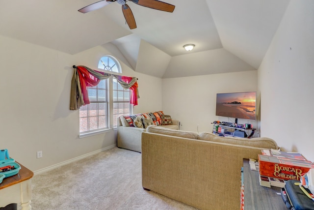 interior space featuring ceiling fan, carpet floors, and lofted ceiling