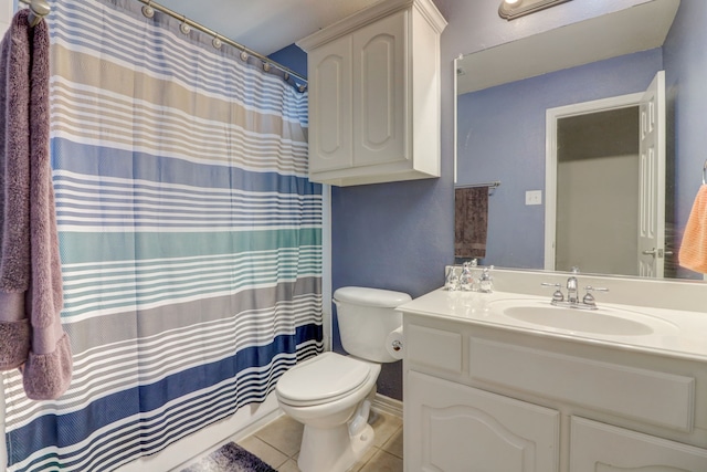 bathroom with toilet, tile flooring, and large vanity